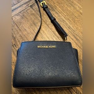 Michael Kors bag, navy blue leather, adjustable shoulder/cross body strap.